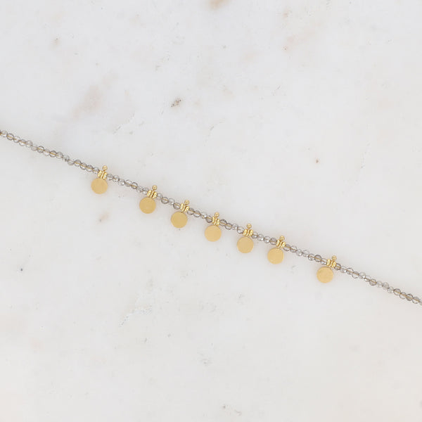 armbandje met zilverkleurige kralen en gladde goudkleurige muntjes | stainless steel