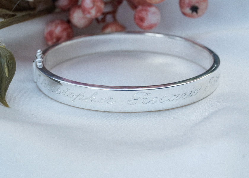 Echt zilveren bangle met de namen van haar (klein) kinderen met een handgravure