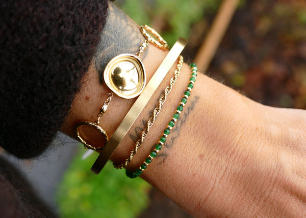 goudkleurige platte hoekige bangle van stainless steel