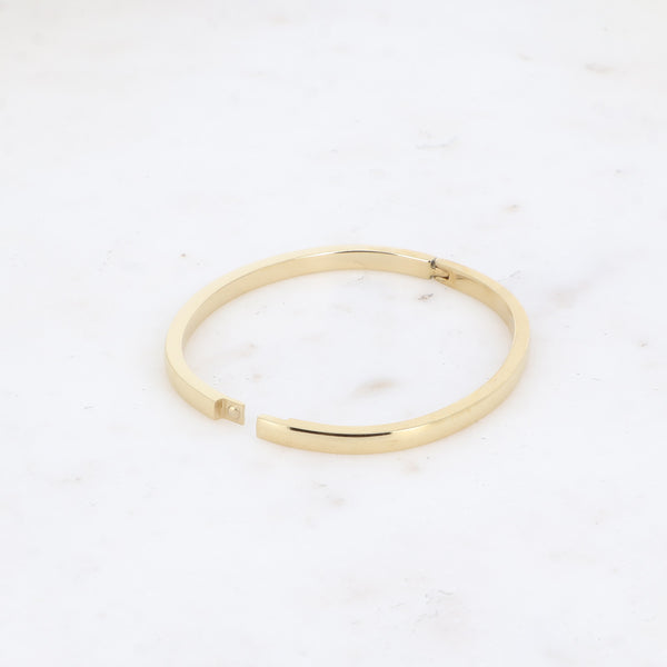 goudkleurige platte hoekige bangle van stainless steel