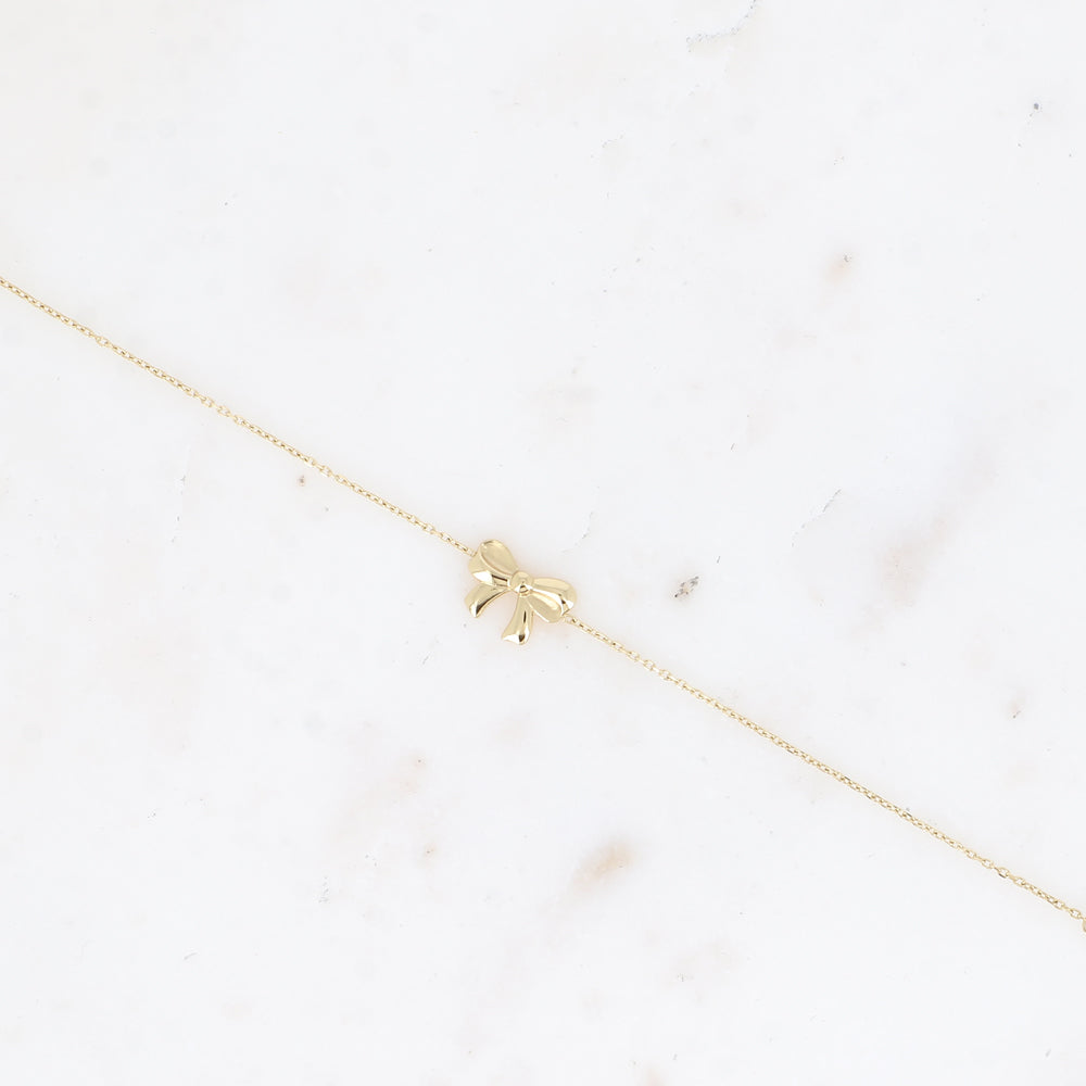 fijn goudkleurig armbandje met strikje 🎀 stainless steel
