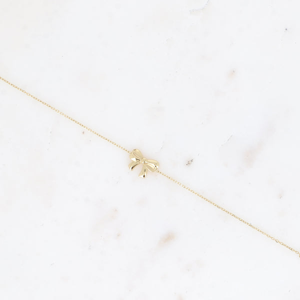 fijn goudkleurig armbandje met strikje 🎀 stainless steel