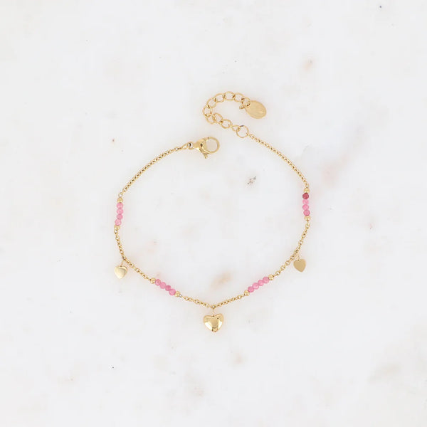 goudkleurig armbandje met roze mineralen en hartje | stainless steel