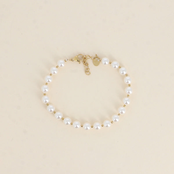 armband van witte parels met goudkleurige bolletjes