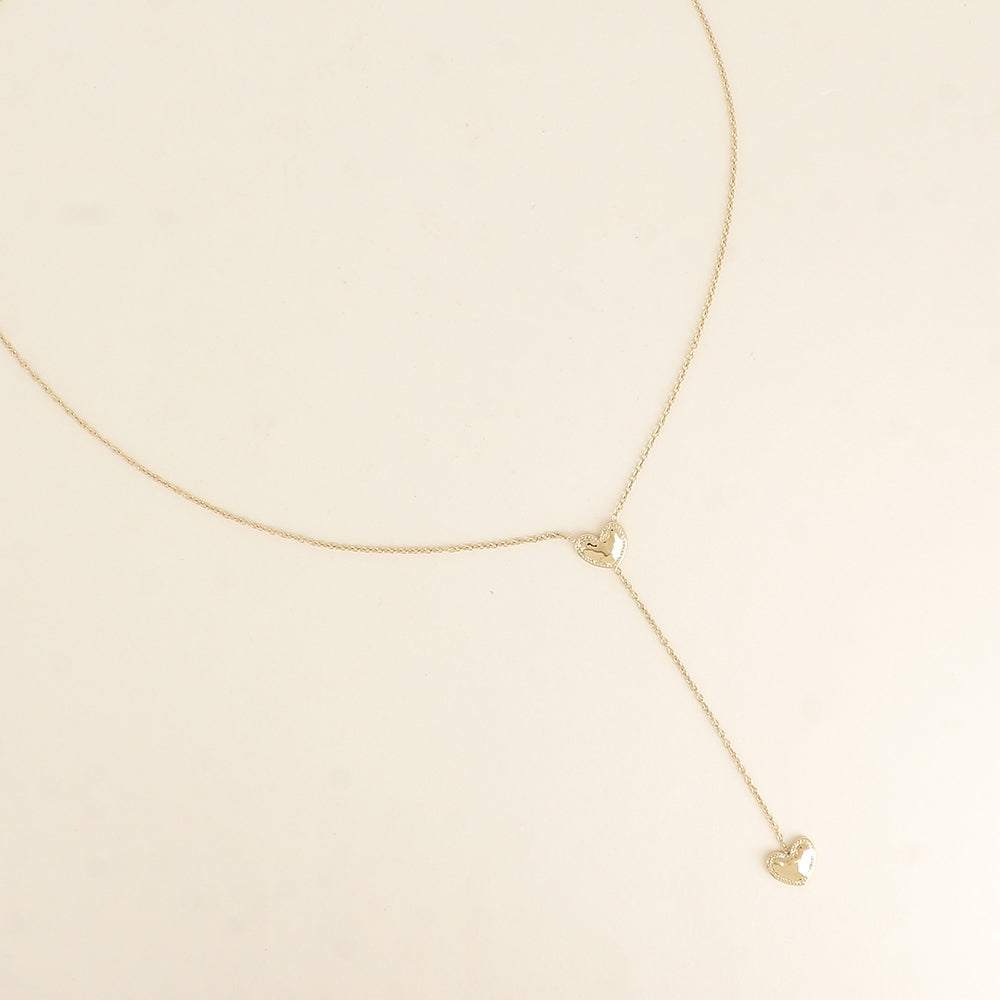 fijn goudkleurig Y collier stainless steel met dichte hartjes