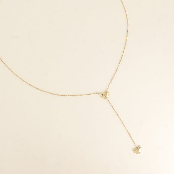 fijn goudkleurig Y collier stainless steel met dichte hartjes