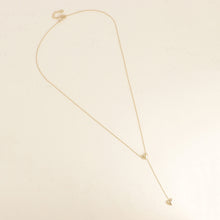 Afbeelding in Gallery-weergave laden, fijn goudkleurig Y collier stainless steel met dichte hartjes
