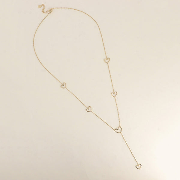 fijn goudkleurig Y collier stainless steel met hartjes tussen de schakels