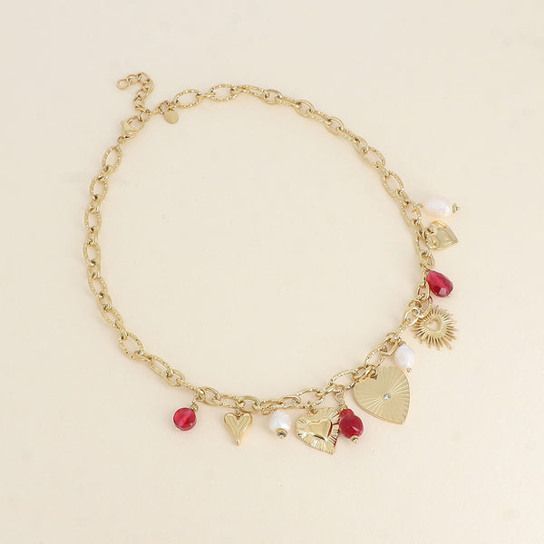 goudkleurig schakel collier met rode bedels stainless steel