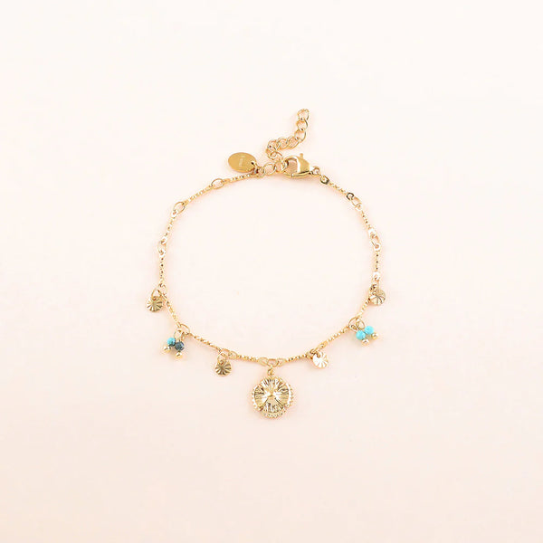goudkleurige armband met muntje en turkoois accenten | stainless steel