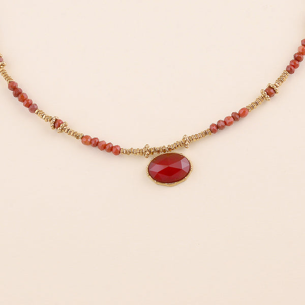 collier van donker burned orange kralen met goudkleurige accenten | stainless steel