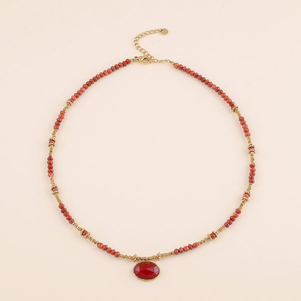 collier van donker burned orange kralen met goudkleurige accenten | stainless steel