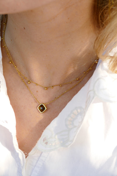goudkleurig collier met donkergroene hanger | stainless steel