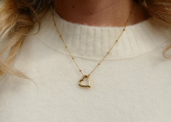 goudkleurig bolletjes collier met open hart stainless steel