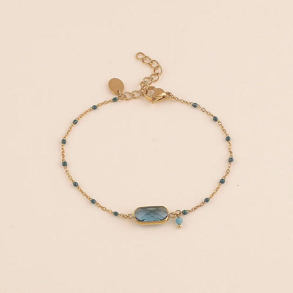 goudkleurig armbandje met blauw middensteen en accenten | stainless steel