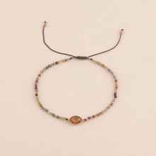 Afbeelding in Gallery-weergave laden, bruin mineralen armbandje met goudkleurige accenten
