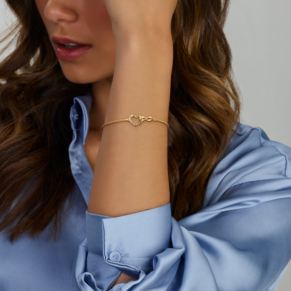schakel armbandje met infinity teken en hartje in elkaar | verguld goud