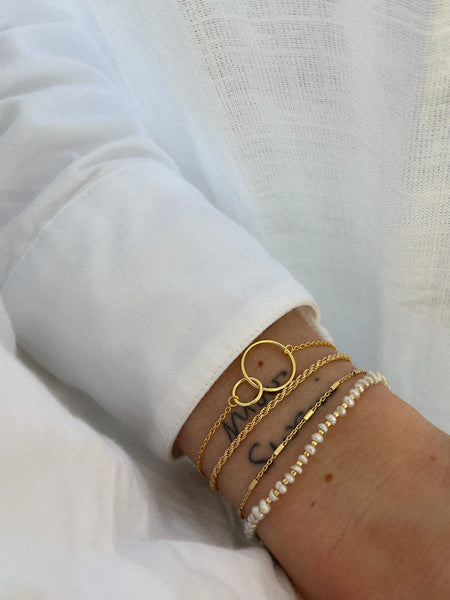 Smal koord armbandje verguld goud